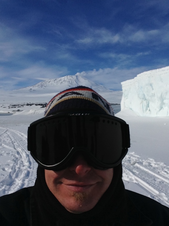 Here I am looking like I have bug eyes.  LOL.  In the background you can see an iceberg frozen in the Ross Sea, and Mt Erebus erupting!  Such an awesome day!!